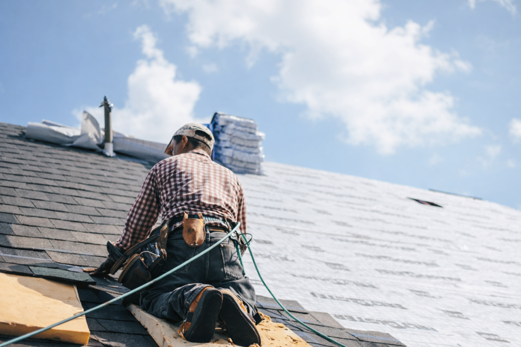Roofer replacing a shingle roof for Timberman Roofing in Crestview, FL