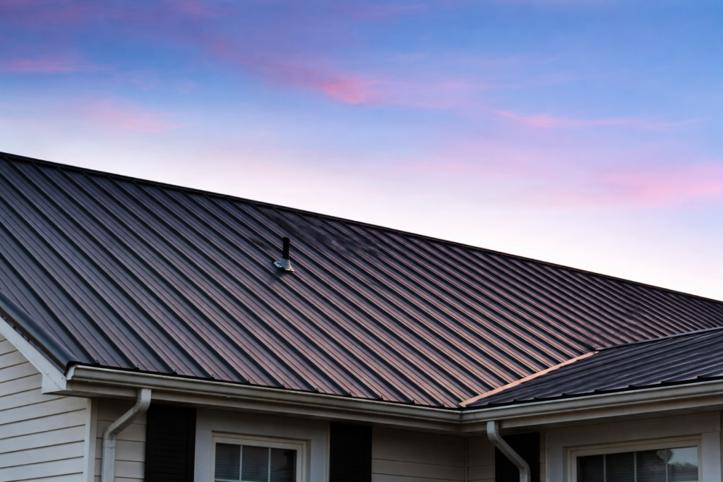 Metal roof at sunset installed by Timberman Roofing in Panama City, FL